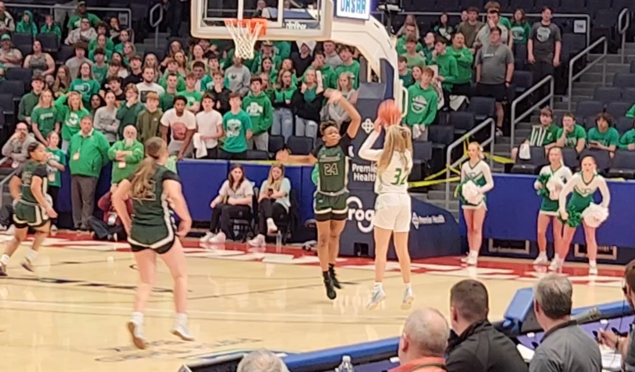 Fairland's Bailey Russell (No. 32) lets a 3-pointer fly in the state semifinals against Laurel on March 15, 2024.